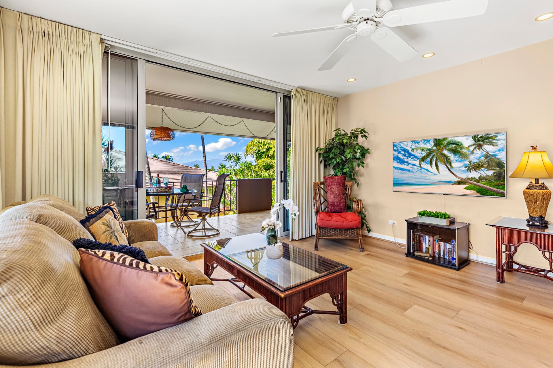 Suite F-201 living room with sliding glass doors opening to the private lanai
